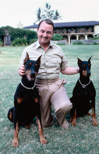 Jonathan Higgins with Zeus and Apollo in the original Magnum P.I. series