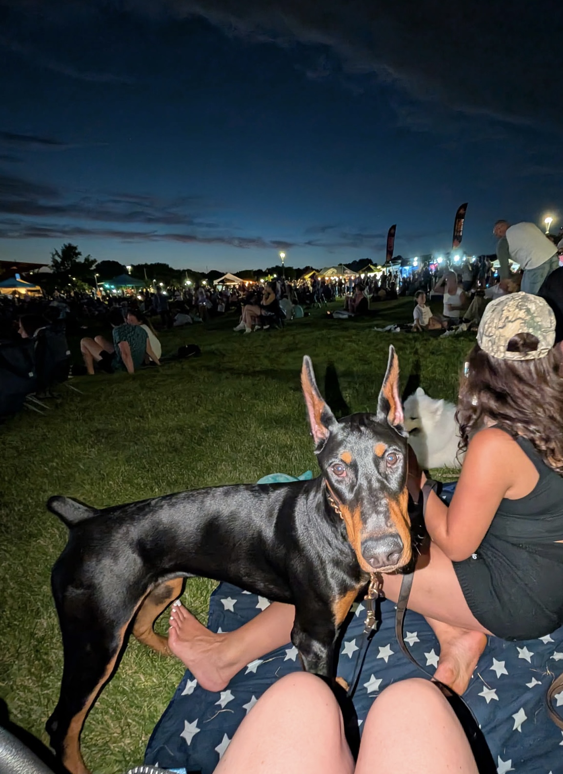 Xena attending an outdoor summer festival with her family